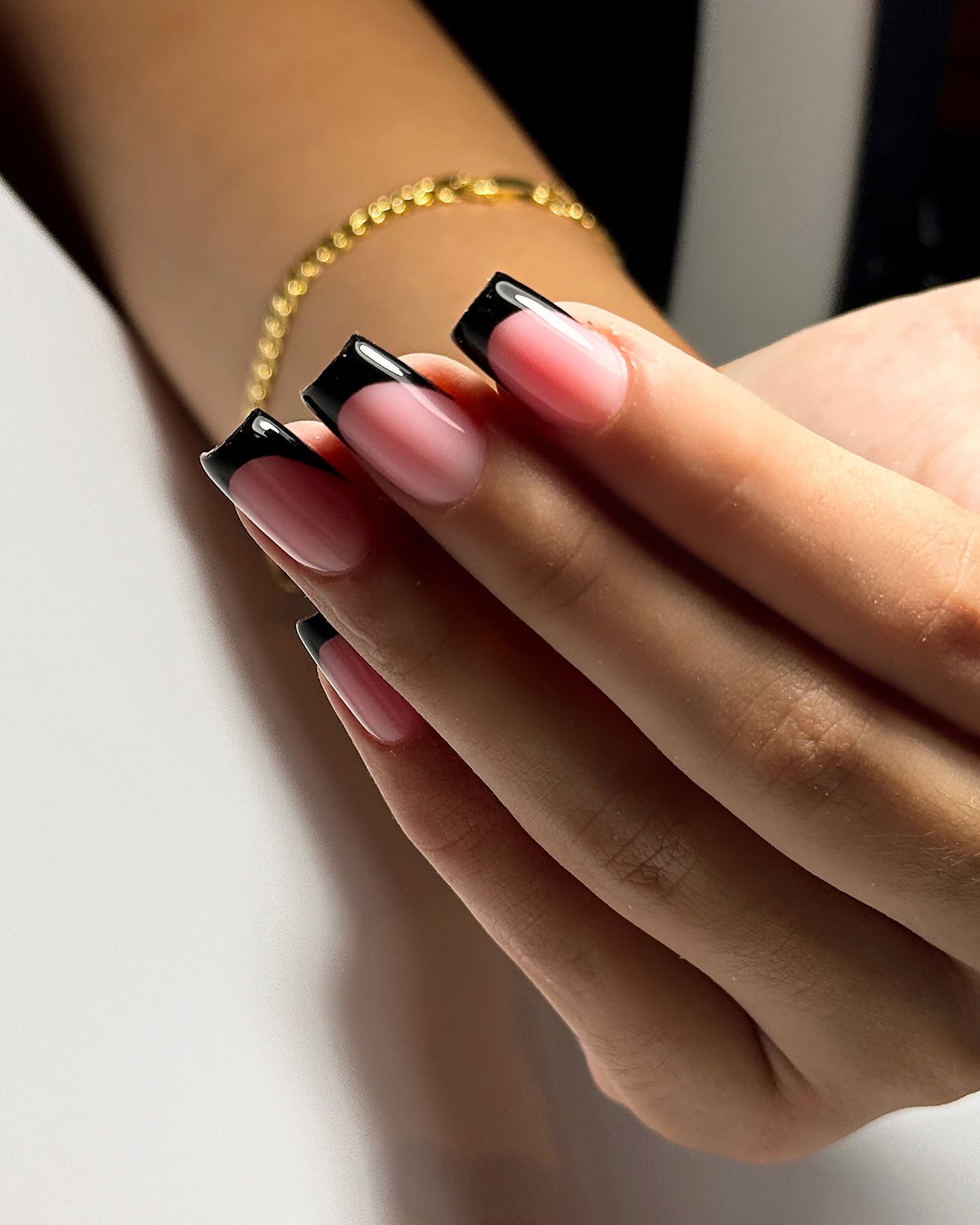 Glossy black tip French manicure on short square nails